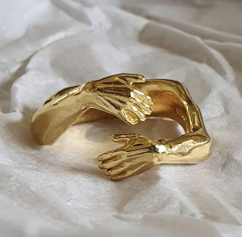 Hands Embracing Ring